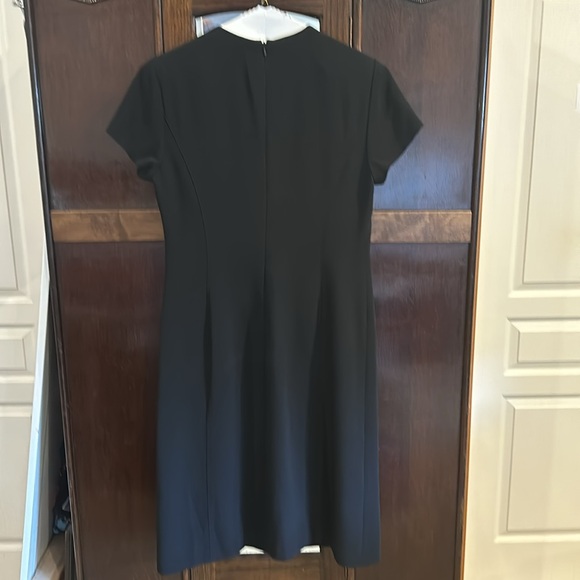 Dressy black just below knee length lined short sleeve dress. - Picture 2 of 5